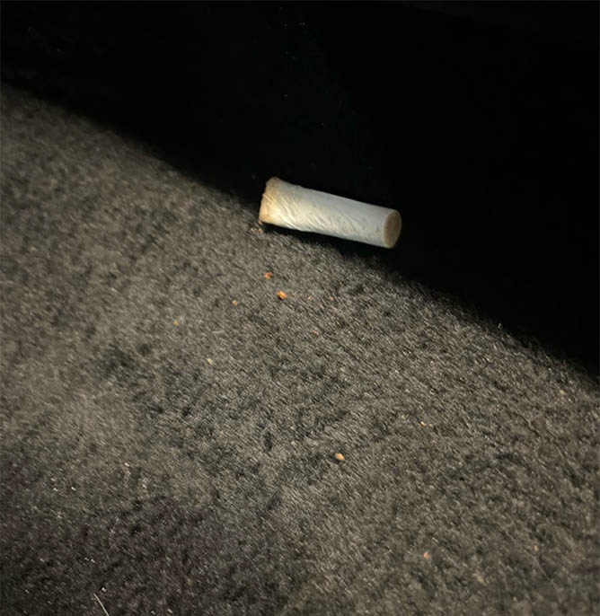 The car rental company claimed to have found a cigarette in this nonsmoker's vehicle. This photo shows a butt on a floor board. But is it this renter's car?