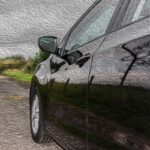 A black rental car without damage.