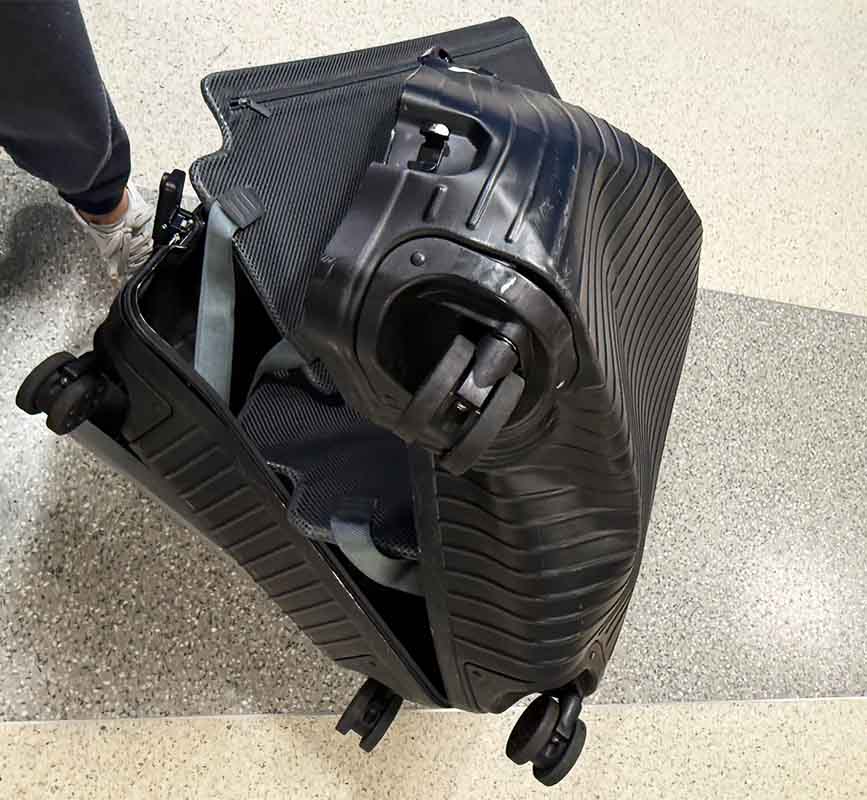 AA destroyed luggage American Airlines reduced this bag to a crumpled mess, What did American Airlines do to this bag?