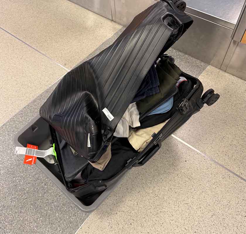 Smashed luggage American Airlines destroyed this bag, What happened to this bag?, Smashed piece of luggage, Did an American Airlines aircraft run this over?