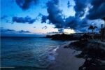 Summer travel scams, avoid scams this summer, sunset in the summer