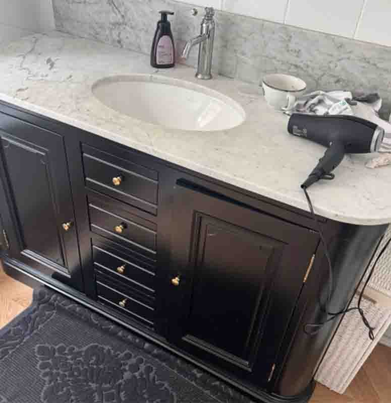$3,500 in damages Airbnb host provides flimsy damage evidence, a light coffee stain on a sink, vacation rental bathroom sink